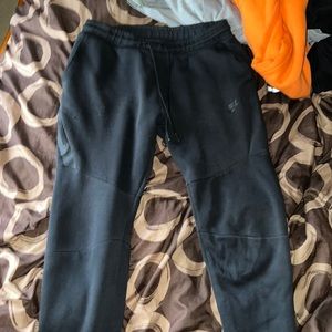 2 black pairs of joggers size medium: Nike Tech, and American Eagle (Take Both)